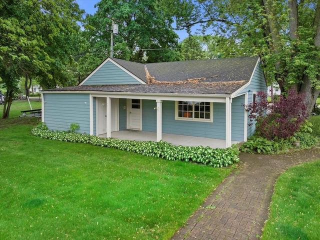 N60W39640 Mary Ln, Oconomowoc, WI 53066 - view of front of house featuring covered porch, a front yard, and roof with shingles