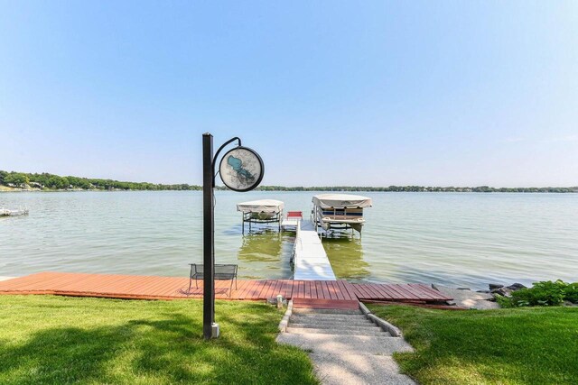 N60W39640 Mary Ln, Oconomowoc, WI 53066 - dock area with a water view, boat lift, and a yard