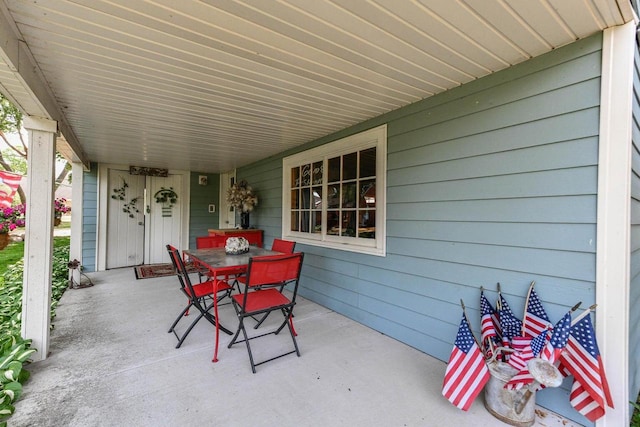 N60W39640 Mary Ln, Oconomowoc, WI 53066 - view of patio / terrace featuring outdoor dining space