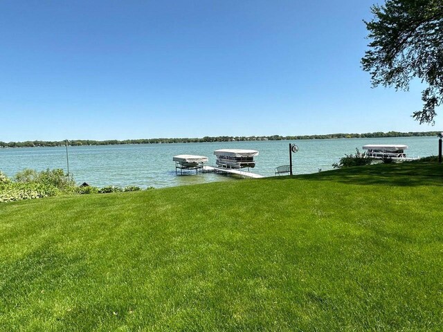 N60W39640 Mary Ln, Oconomowoc, WI 53066 - dock with a lawn and a water view