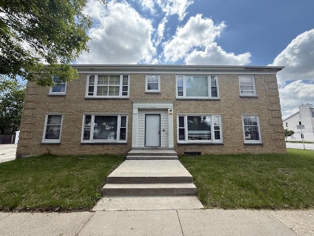 2740 N 61st St, Milwaukee, WI 53210 - view of front facade with brick siding and a front lawn