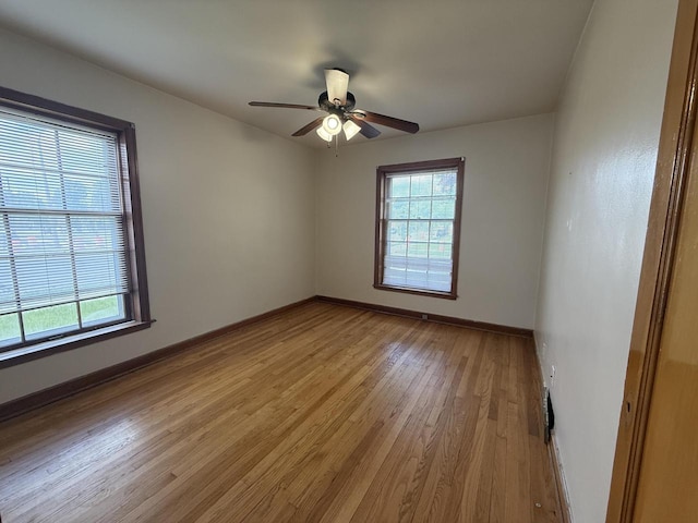 2740 N 61st St, Milwaukee, WI 53210 - unfurnished room featuring healthy amount of natural light, light wood-type flooring, a ceiling fan, and baseboards