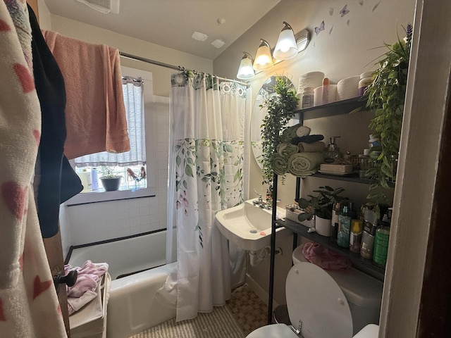 2740 N 61st St, Milwaukee, WI 53210 - bathroom with shower / bath combination with curtain, a sink, and toilet