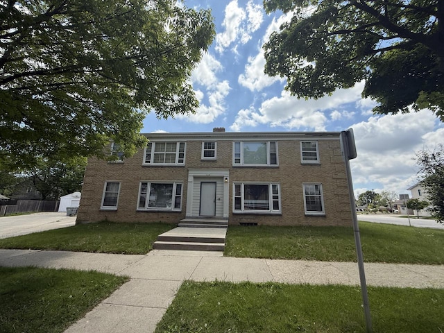 2740 N 61st St, Milwaukee, WI 53210 - view of front facade featuring a front yard and brick siding