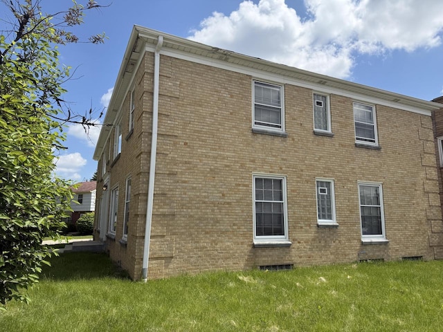 2740 N 61st St, Milwaukee, WI 53210 - view of side of home featuring a lawn and brick siding