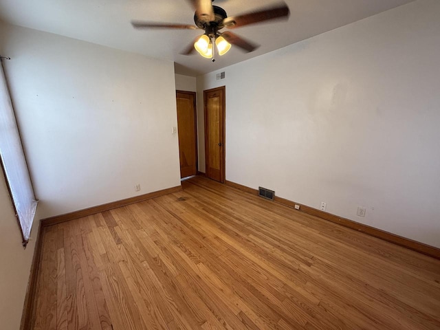 2740 N 61st St, Milwaukee, WI 53210 - unfurnished room featuring light wood finished floors, ceiling fan, and baseboards
