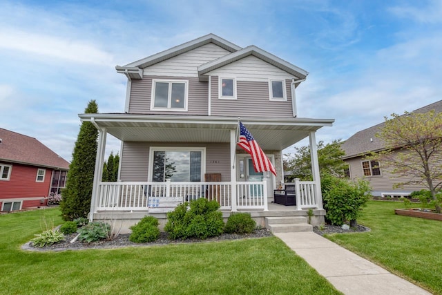 1261 Tara Dr, Sun Prairie, WI 53590 - view of front of home featuring covered porch and a front lawn
