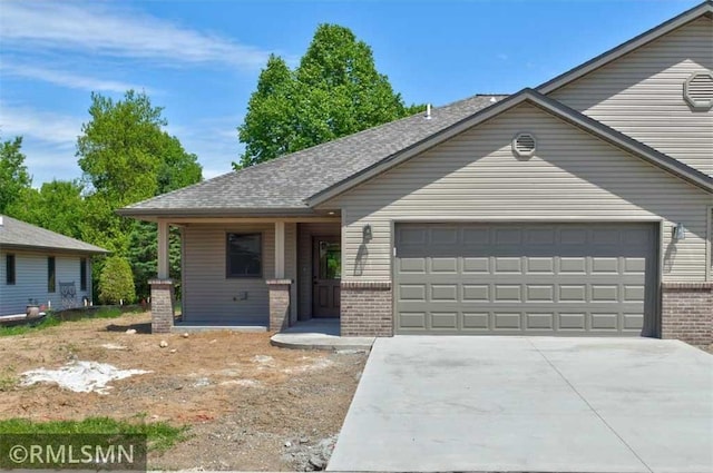 622 Pondhurst Dr, Amery, WI 54001 - ranch-style house featuring an attached garage, brick siding, and driveway