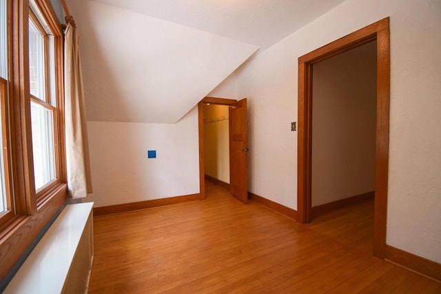 1139 W Highland St, Whitewater, WI 53190 - bonus room with vaulted ceiling, light wood finished floors, and baseboards