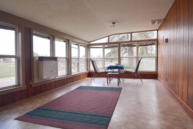 1139 W Highland St, Whitewater, WI 53190 - sunroom featuring wooden walls, lofted ceiling, a textured ceiling, and cooling unit