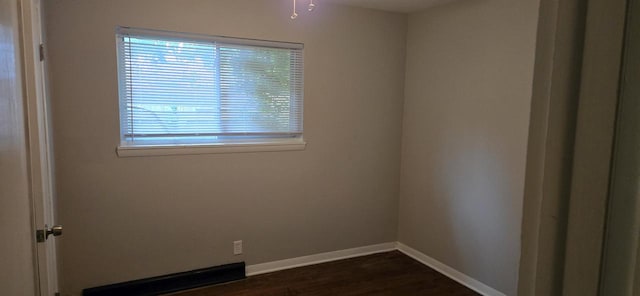 2112 Virginia St, Racine, WI 53405 - empty room with healthy amount of natural light, baseboards, and dark wood-style flooring