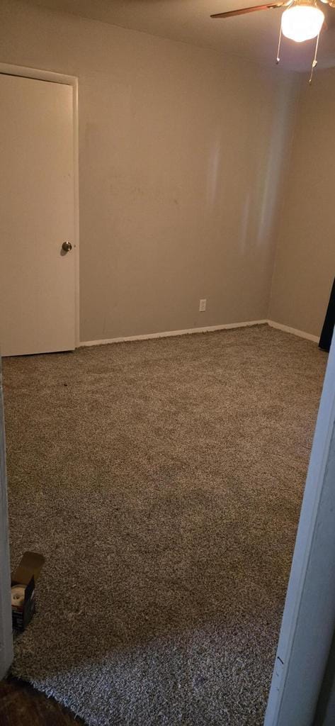 2112 Virginia St, Racine, WI 53405 - unfurnished room featuring dark carpet, ceiling fan, and baseboards