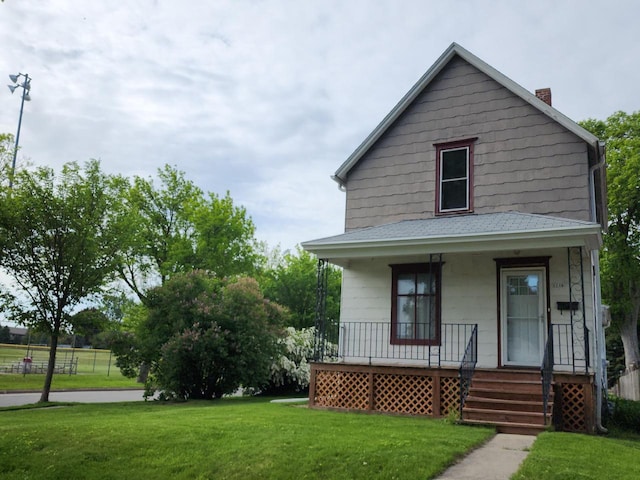 9524 W Mitchell St, West Allis, WI 53214 - view of front of house featuring a porch, a front yard, a chimney, and roof with shingles