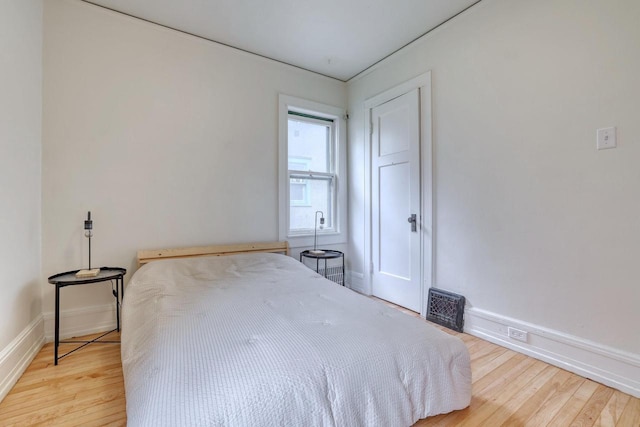 1551 N 50th St, Milwaukee, WI 53208 - bedroom featuring wood finished floors and baseboards