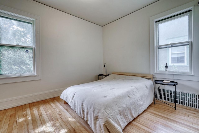1551 N 50th St, Milwaukee, WI 53208 - bedroom featuring wood-type flooring and baseboards