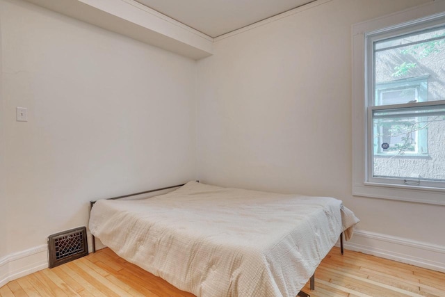 1551 N 50th St, Milwaukee, WI 53208 - bedroom with wood-type flooring and baseboards