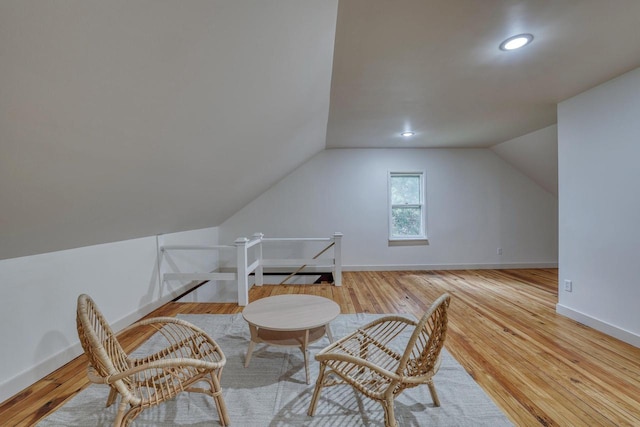 1551 N 50th St, Milwaukee, WI 53208 - sitting room featuring vaulted ceiling, wood finished floors, an upstairs landing, baseboards, and recessed lighting