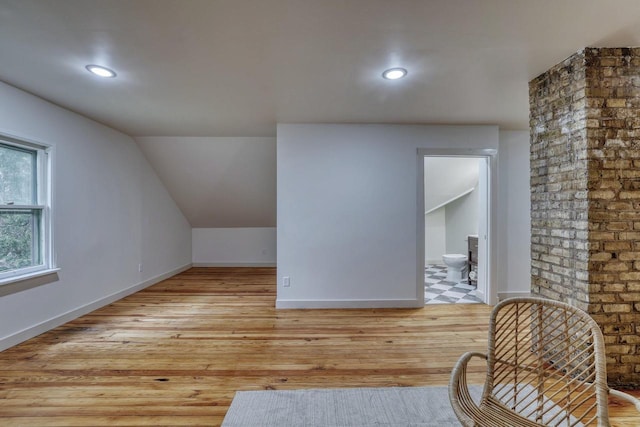 1551 N 50th St, Milwaukee, WI 53208 - bonus room featuring light wood-type flooring, lofted ceiling, baseboards, and recessed lighting