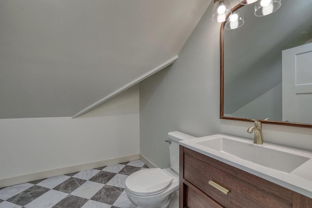 1551 N 50th St, Milwaukee, WI 53208 - half bath with toilet, vanity, vaulted ceiling, and baseboards