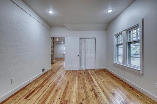 1551 N 50th St, Milwaukee, WI 53208 - unfurnished bedroom with light wood-type flooring, baseboards, recessed lighting, and a closet
