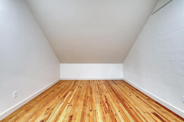 1551 N 50th St, Milwaukee, WI 53208 - bonus room with light wood-style flooring, lofted ceiling, and baseboards