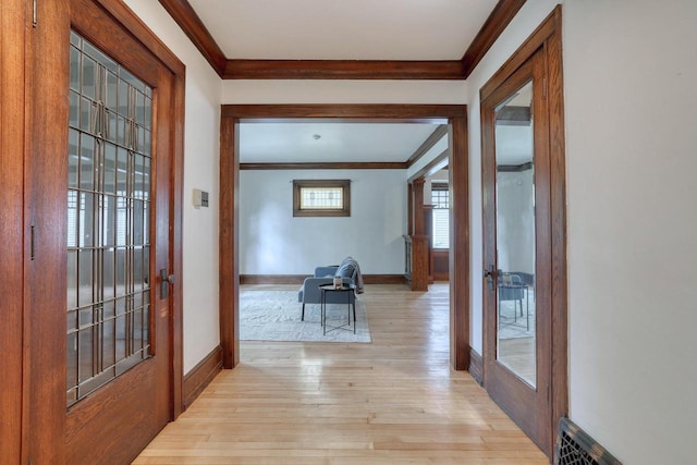 1551 N 50th St, Milwaukee, WI 53208 - hallway featuring ornamental molding, light wood-style flooring, french doors, and baseboards
