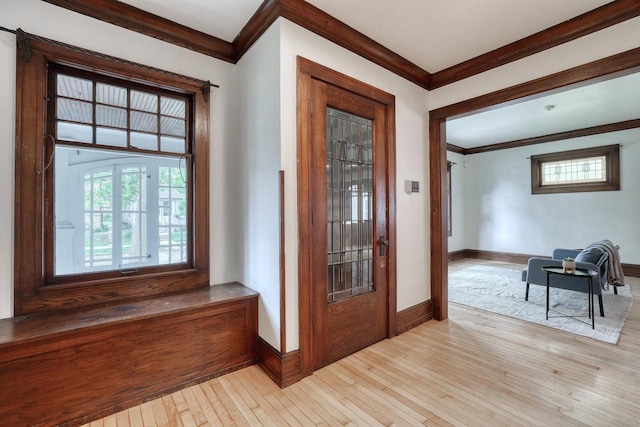 1551 N 50th St, Milwaukee, WI 53208 - foyer featuring crown molding, light wood-type flooring, and baseboards