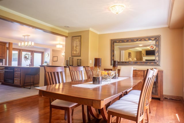 23920 US Highway 2, Ashland, WI 54806 - dining area with a chandelier, hardwood / wood-style floors, and ornamental molding