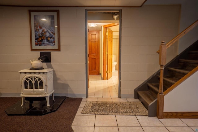 23920 US Highway 2, Ashland, WI 54806 - stairway featuring tile patterned floors and a wood stove