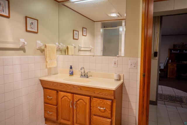 23920 US Highway 2, Ashland, WI 54806 - bathroom featuring tile walls, vanity, a shower stall, tile patterned flooring, and a wainscoted wall