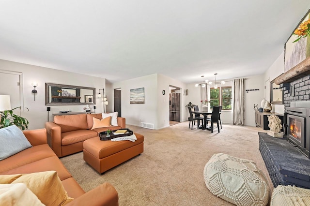 N79W34221 Petersen Rd, Oconomowoc, WI 53066 - living room featuring a chandelier, light carpet, and baseboards