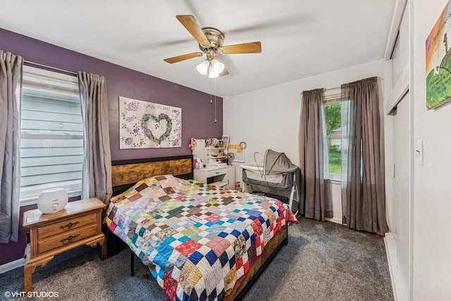 2300 W Lawn Ave, Racine, WI 53405 - carpeted bedroom featuring baseboards and a ceiling fan
