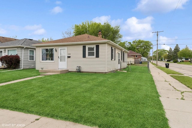 2300 W Lawn Ave, Racine, WI 53405 - view of front of home featuring a chimney and a front yard