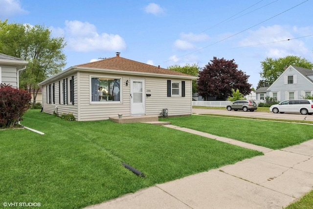 2300 W Lawn Ave, Racine, WI 53405 - bungalow-style home with a front yard
