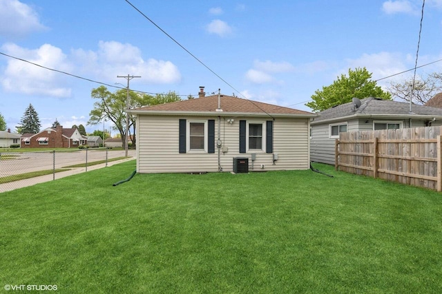 2300 W Lawn Ave, Racine, WI 53405 - back of house featuring central AC unit and roof with shingles