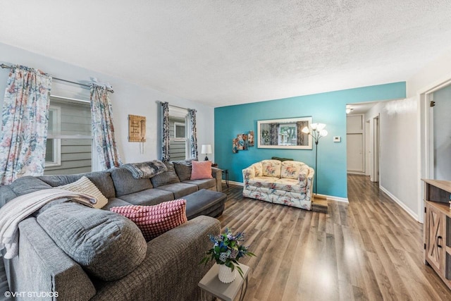 2300 W Lawn Ave, Racine, WI 53405 - living area with wood finished floors, a textured ceiling, and baseboards