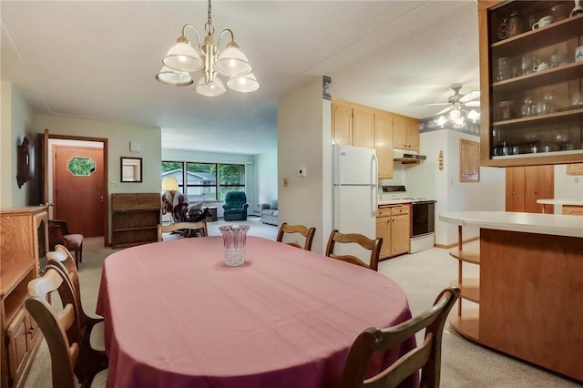 407 S Scott St, Elmwood, WI 54740 - dining space featuring light carpet, a ceiling fan, and a chandelier