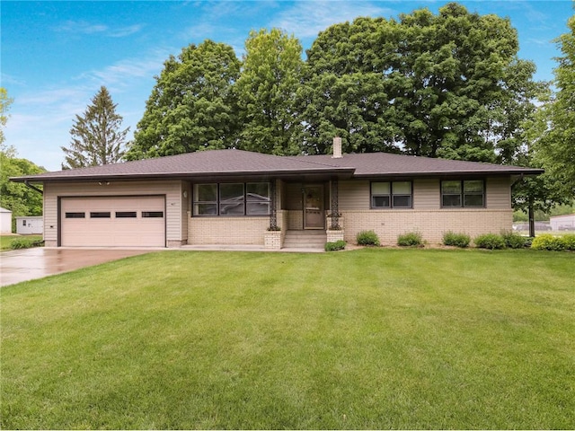 407 S Scott St, Elmwood, WI 54740 - view of front of home featuring a chimney, an attached garage, a front lawn, concrete driveway, and brick siding