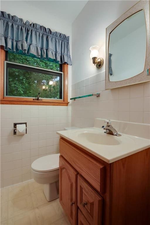 407 S Scott St, Elmwood, WI 54740 - bathroom featuring vanity, toilet, and tile walls
