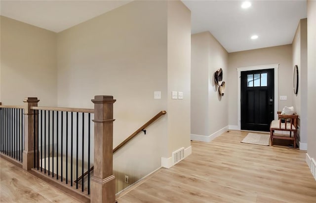 4098 141st St, Chippewa Falls, WI 54729 - entrance foyer featuring baseboards, wood finished floors, and recessed lighting