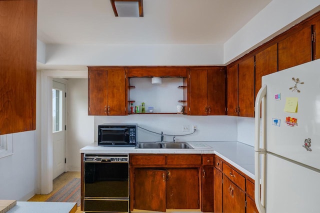 7312 5th Ave, Kenosha, WI 53143 - kitchen with black appliances, a sink, open shelves, light countertops, and brown cabinetry