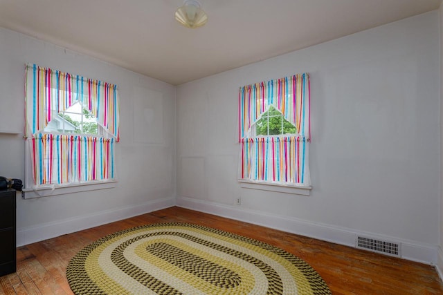 7312 5th Ave, Kenosha, WI 53143 - unfurnished room featuring wood finished floors and baseboards