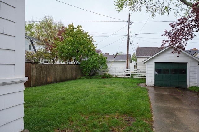 7312 5th Ave, Kenosha, WI 53143 - view of yard with asphalt driveway, a garage, and an outbuilding