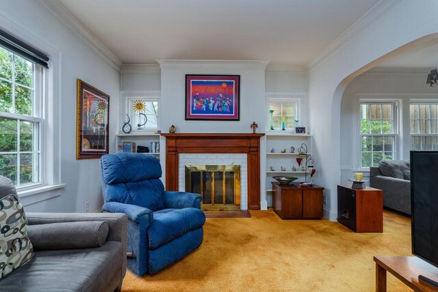 7312 5th Ave, Kenosha, WI 53143 - living room with arched walkways, carpet floors, ornamental molding, and a brick fireplace