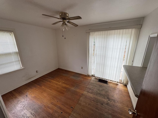 7715 18th Ave, Kenosha, WI 53143 - spare room with ceiling fan, wood finished floors, and baseboards