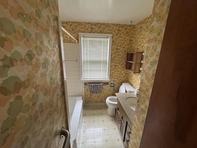 7715 18th Ave, Kenosha, WI 53143 - bathroom featuring toilet, bathtub / shower combination, vanity, and baseboards