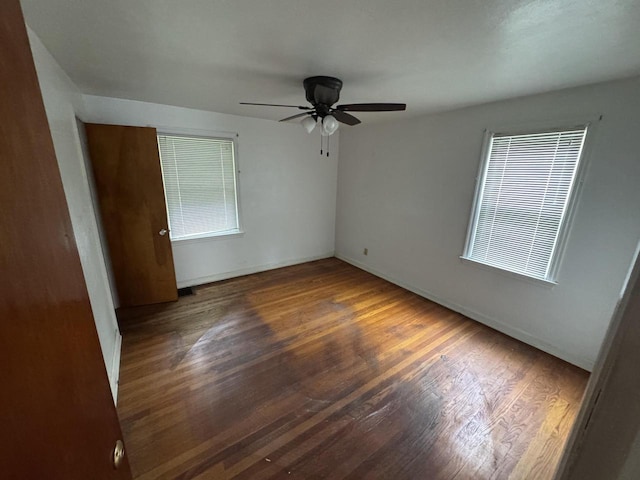 7715 18th Ave, Kenosha, WI 53143 - unfurnished room featuring wood finished floors, a ceiling fan, and baseboards