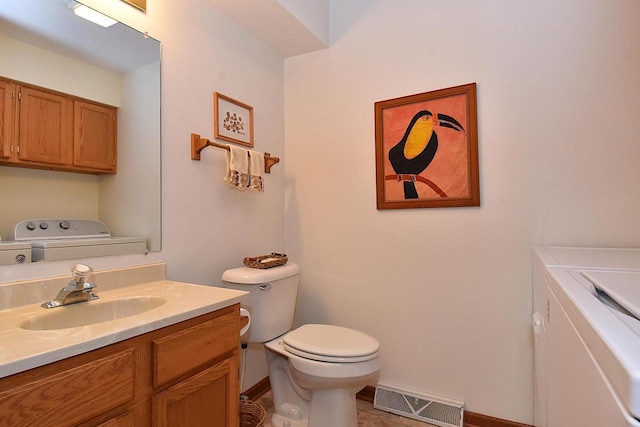 10320 W Whitnall Edge Cir Unit A, Franklin, WI 53132 - bathroom featuring independent washer and dryer, toilet, vanity, and baseboards