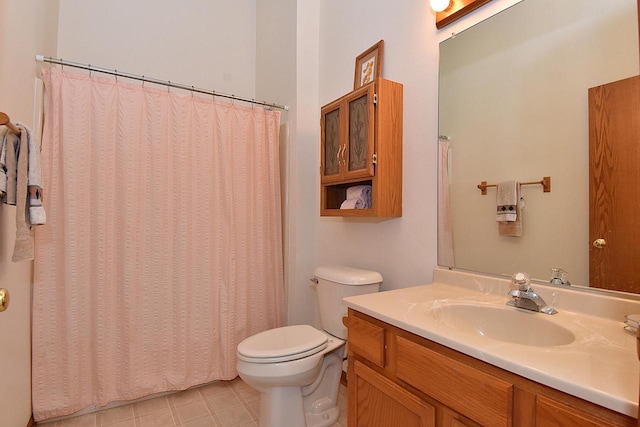 10320 W Whitnall Edge Cir Unit A, Franklin, WI 53132 - bathroom with toilet, vanity, curtained shower, and tile patterned floors