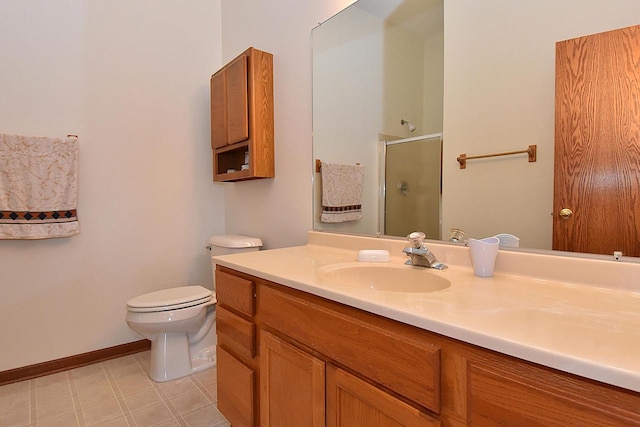 10320 W Whitnall Edge Cir Unit A, Franklin, WI 53132 - bathroom with a shower stall, toilet, vanity, tile patterned floors, and baseboards
